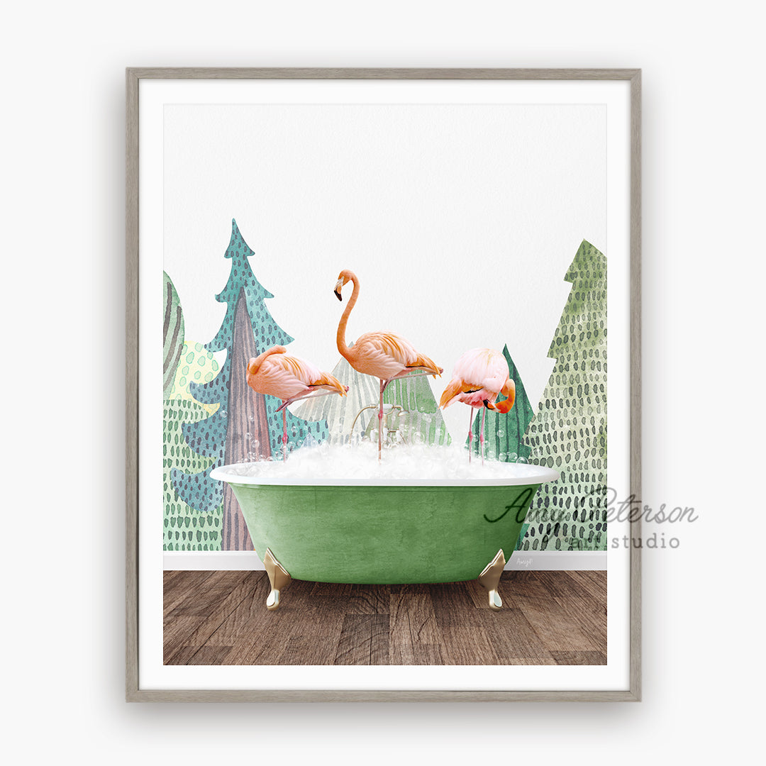 three flamingos in a bathtub with pine trees in the background