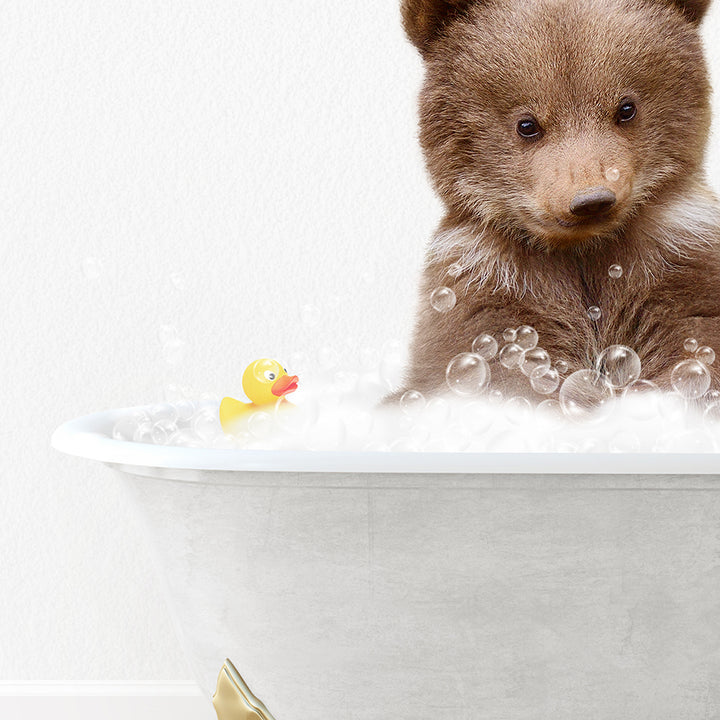 a brown bear sitting in a bathtub with bubbles