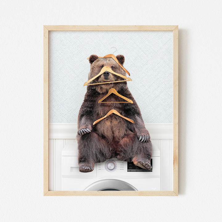 a picture of a bear with clothes tied to it's back