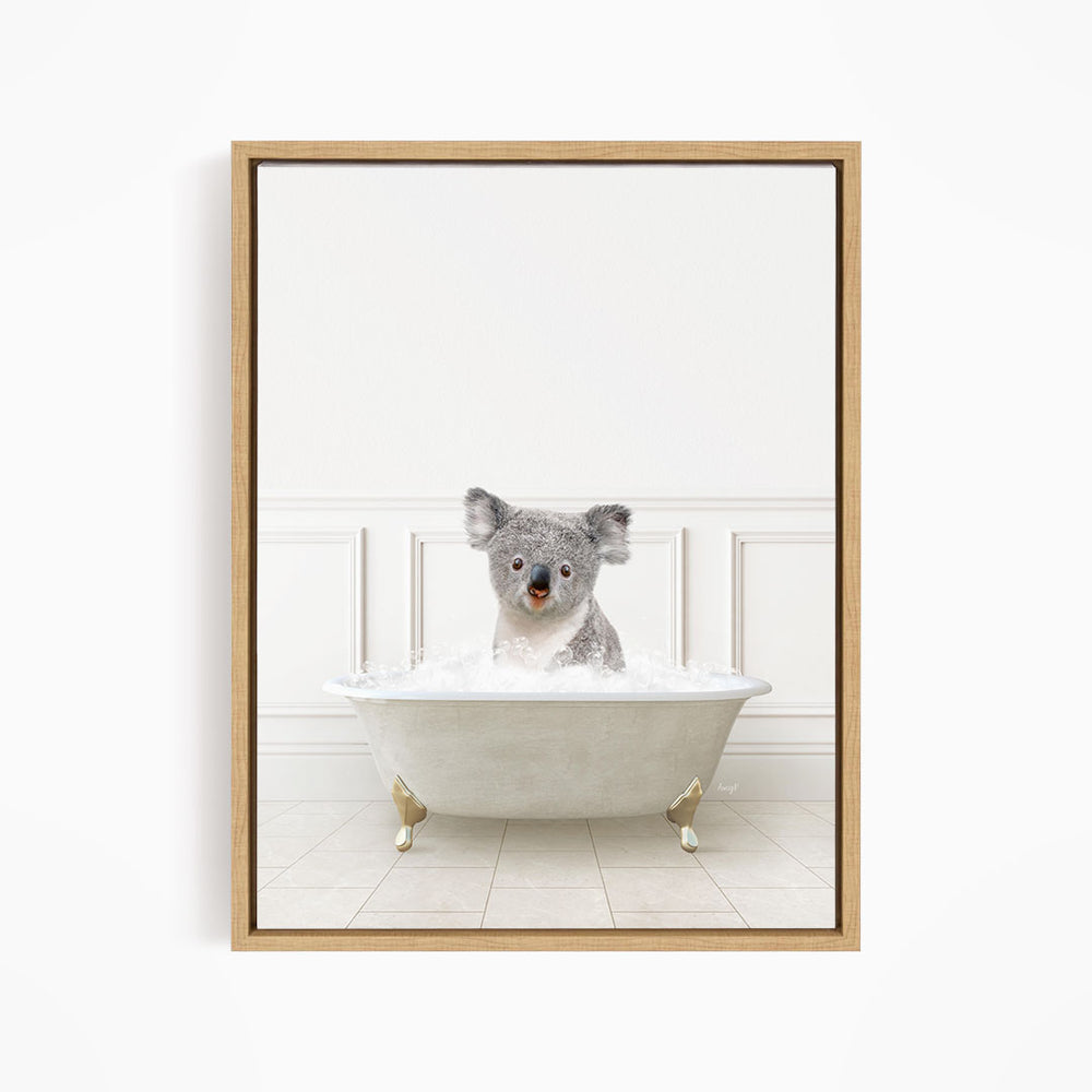 A koala bear sitting in a bathtub filled with water, looking directly at the camera.