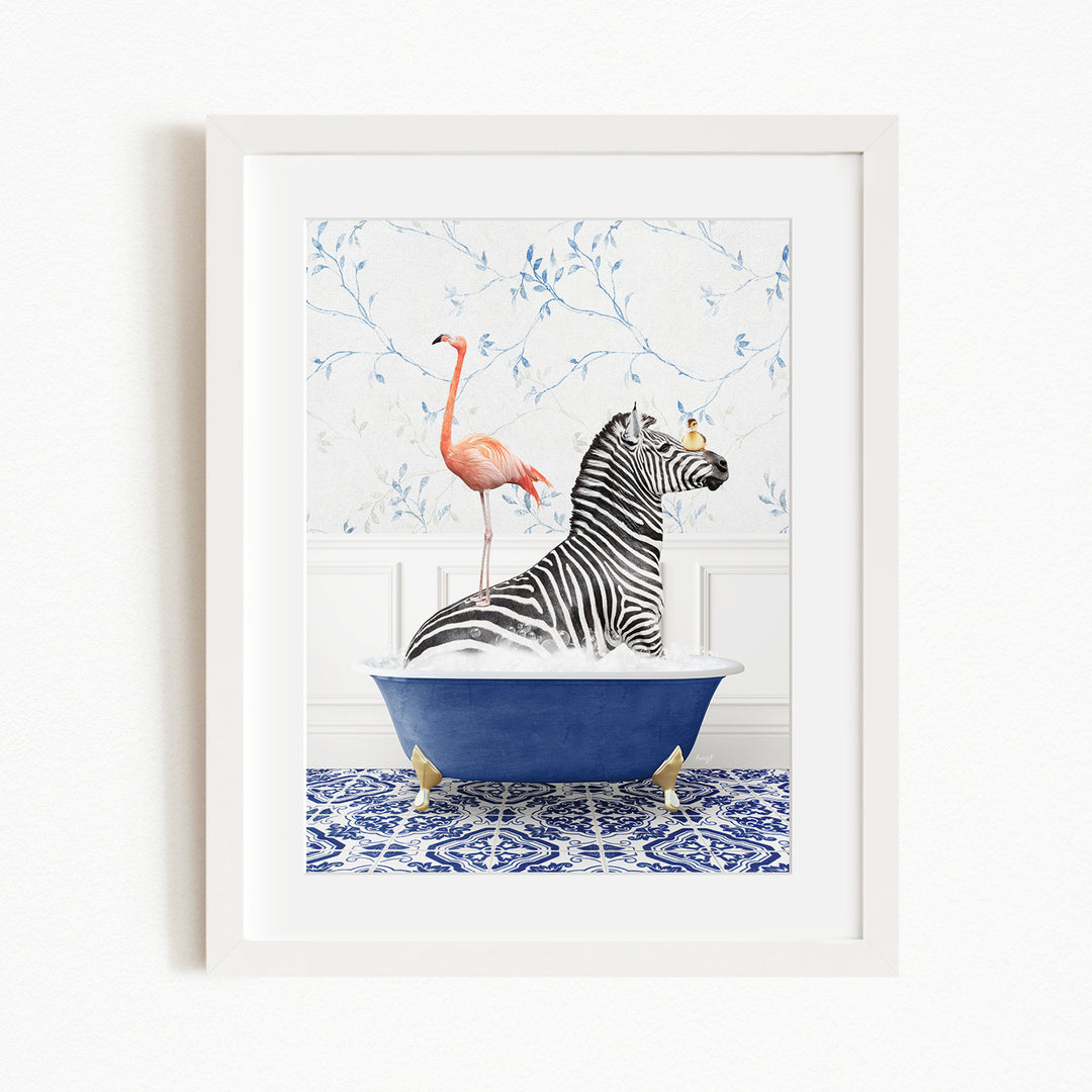 A framed image depicting a zebra sitting in a blue bathtub, with a pink flamingo standing on its back and a bird perched on its head.
