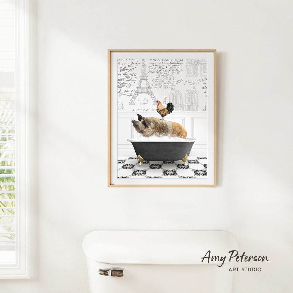 A framed illustration of a dog sitting in a bathtub, with a rooster perched on the edge of the tub, is displayed on a white wall.