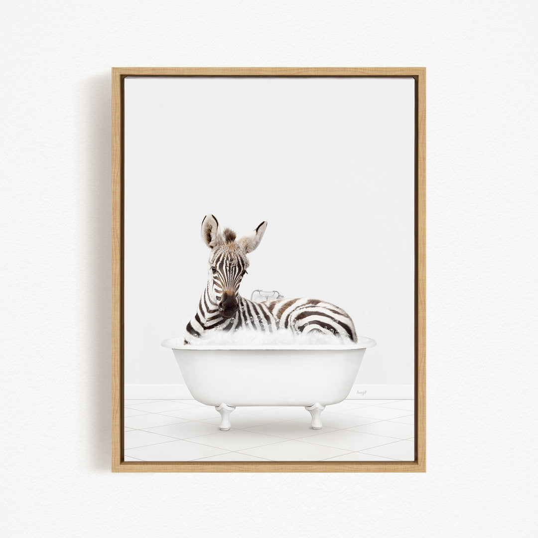 A zebra is sitting in a white bathtub, surrounded by bubbles, creating a whimsical and playful scene.