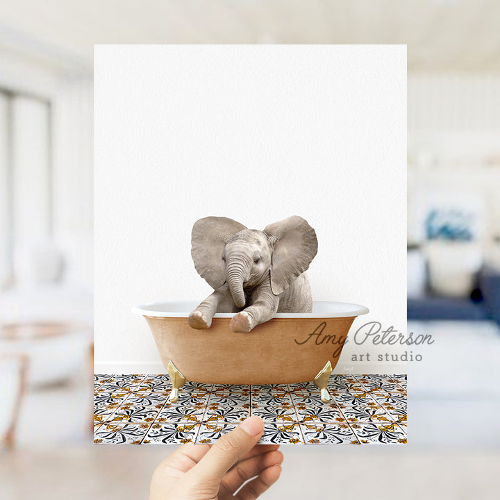 a hand holding a card with an elephant in a bathtub