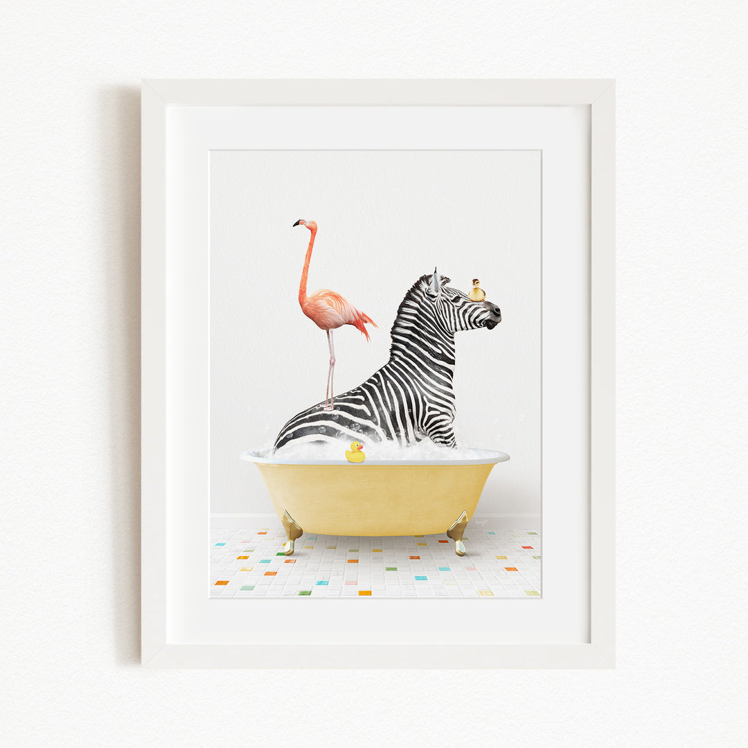 A framed image depicting a zebra sitting in a yellow bathtub, with a pink flamingo standing on its back and a yellow rubber duck floating on the water.