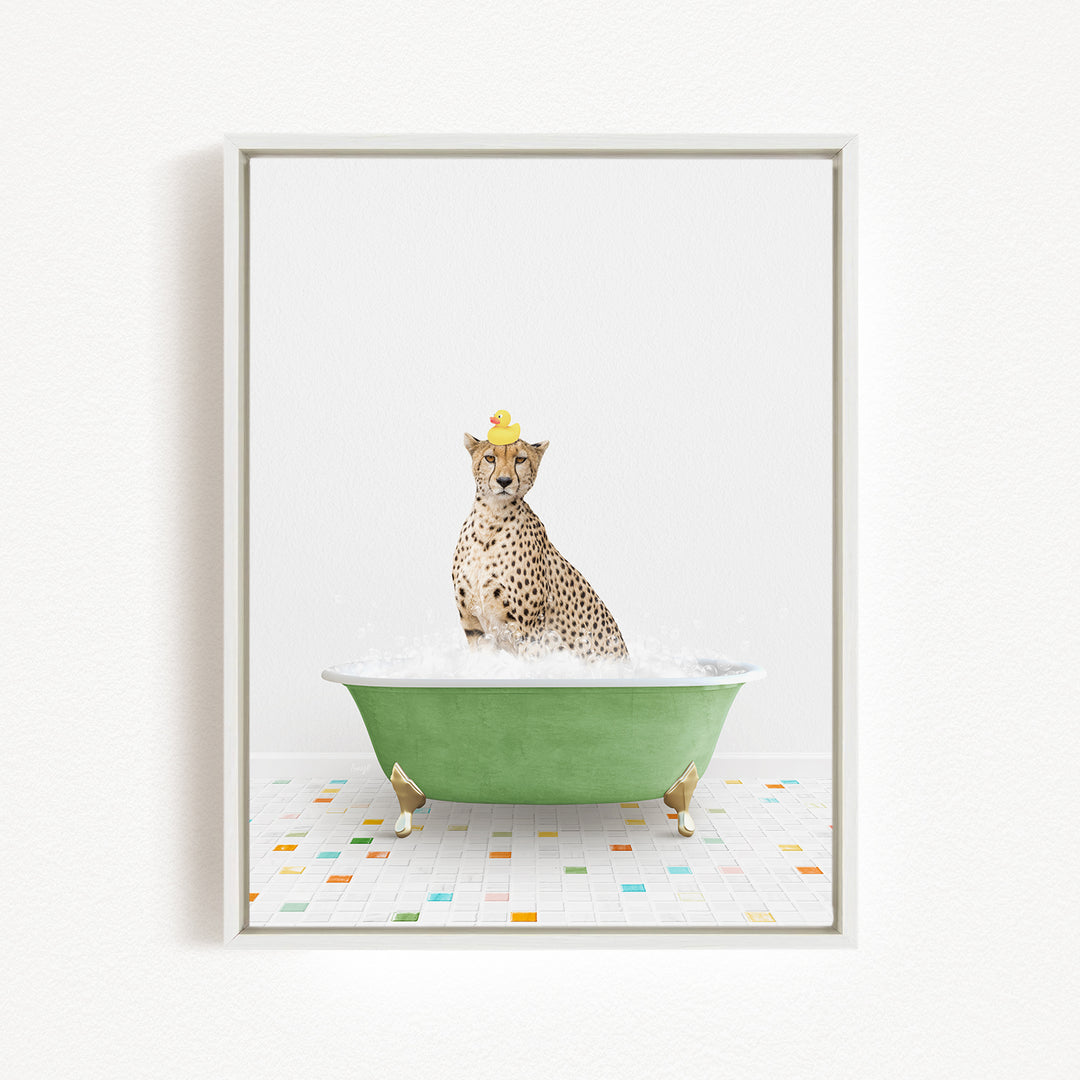 A cheetah wearing a yellow rubber duck hat is sitting in a green bathtub filled with bubbles, surrounded by a colorful tiled floor.