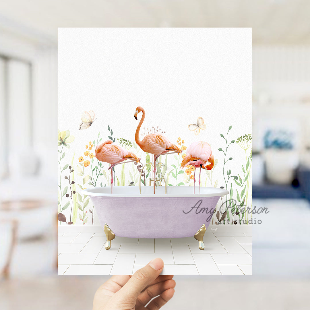 a person holding up a card with flamingos in a bathtub