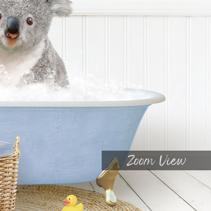 A koala bear sitting in a blue bathtub filled with bubbles, surrounded by rubber ducks and a basket.