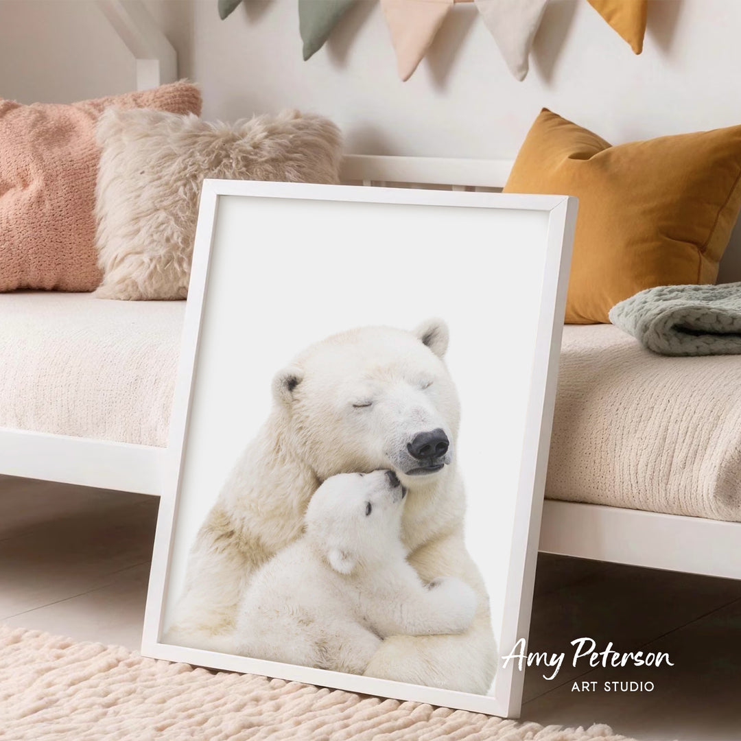A framed image of a mother polar bear and her cub resting together, with the mother's eyes closed and the cub snuggled close to her.