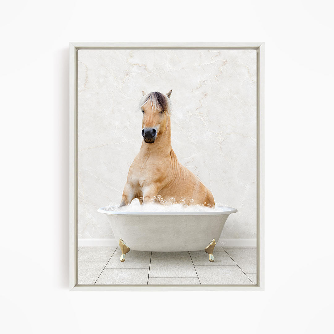 A light brown horse is sitting in a white bathtub filled with water, creating a whimsical and playful scene.