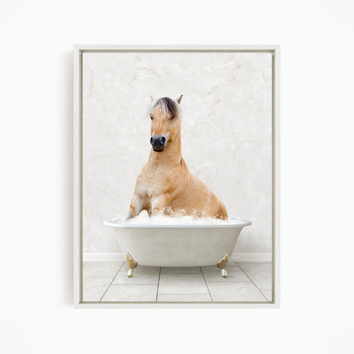 A light brown horse is sitting in a white bathtub filled with water, creating a whimsical and playful scene.