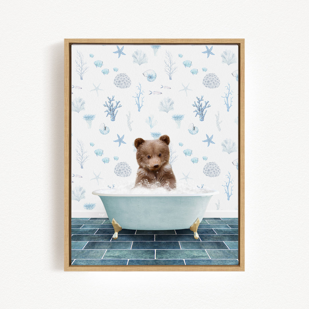 A brown bear sitting in a blue bathtub filled with water, surrounded by a pattern of blue and white sea creatures and plants.