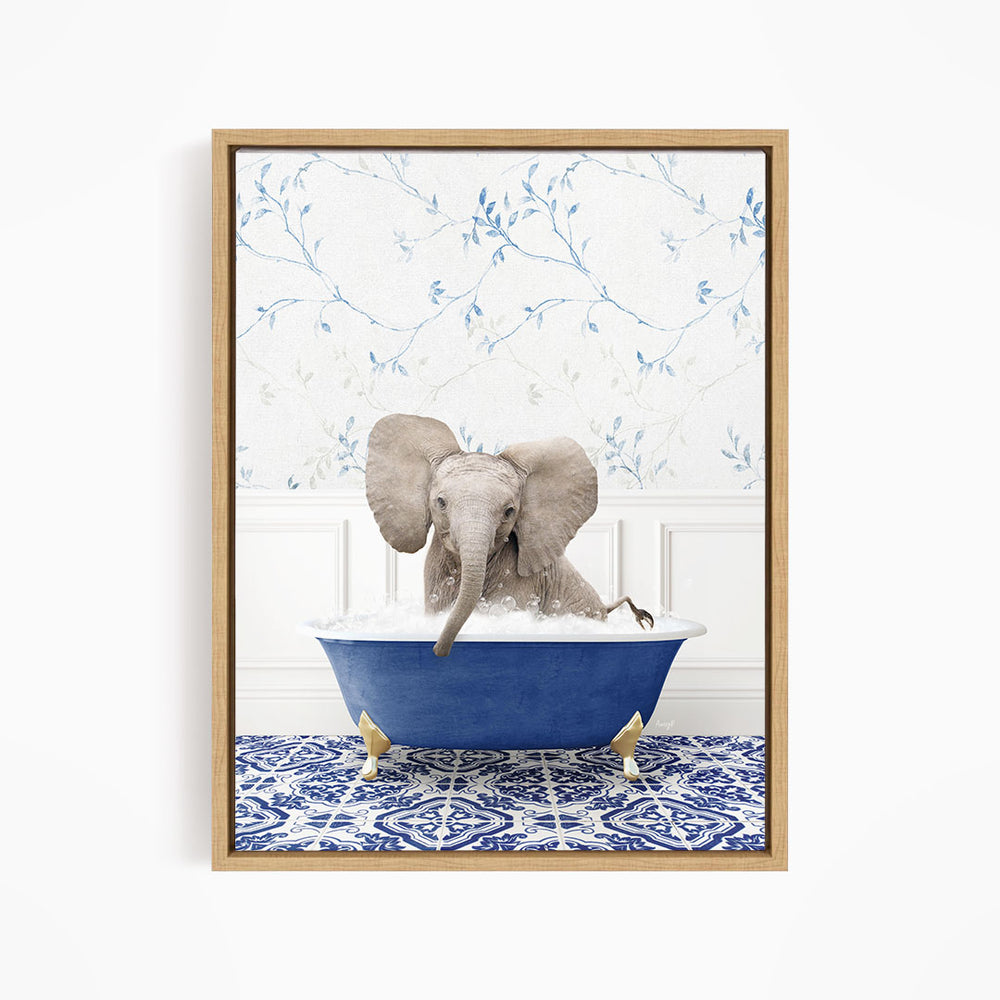 A baby elephant sitting in a blue bathtub filled with water, surrounded by a blue and white patterned rug.