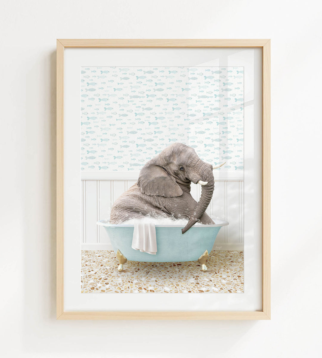 A gray elephant is sitting in a blue bathtub filled with water, surrounded by a patterned wall and a tiled floor.