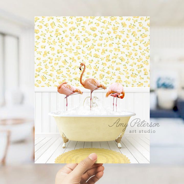 a person holding up a card with flamingos in a bathtub