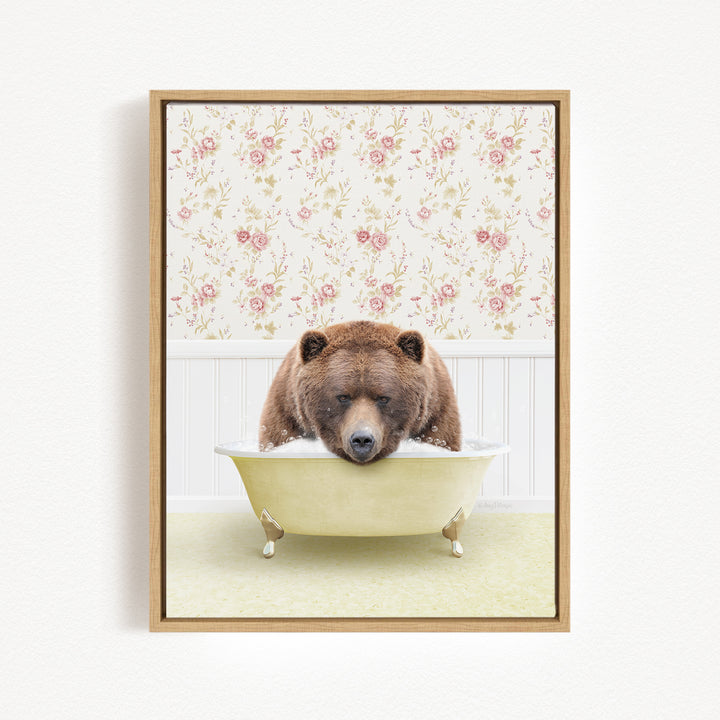 A brown bear is sitting in a bathtub filled with water, surrounded by a floral wallpaper.