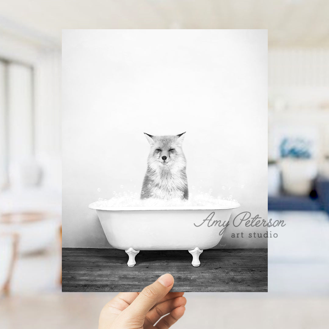 a person holding up a card with a picture of a cat in a bathtub