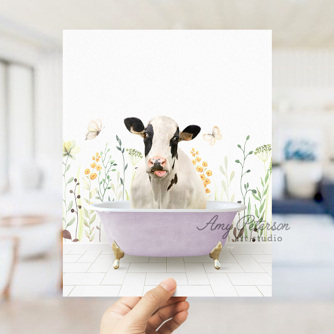 a person holding up a card with a picture of a cow in a bathtub