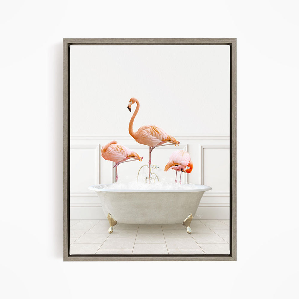 A framed image depicting three flamingos standing in a white bathtub filled with water.