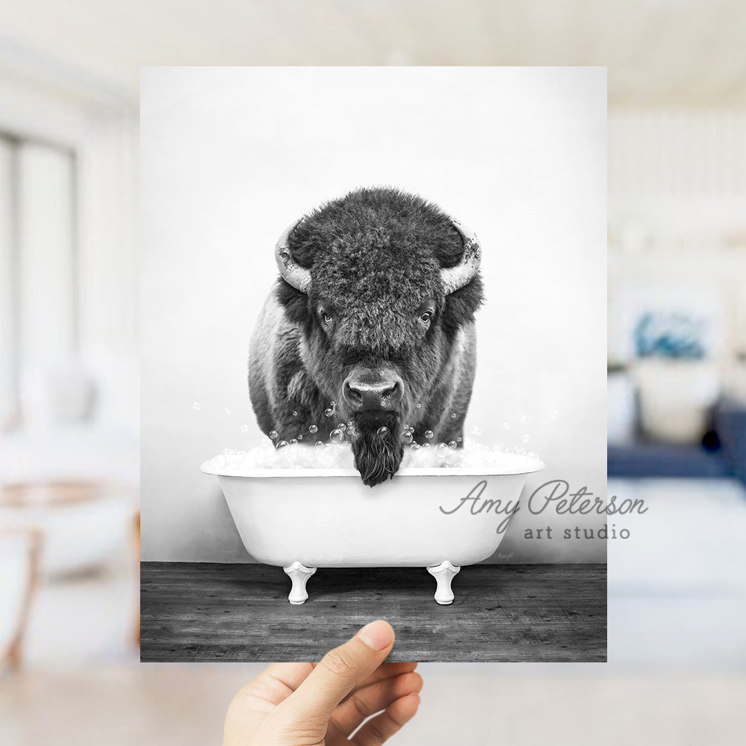 a black and white photo of a bison in a bathtub