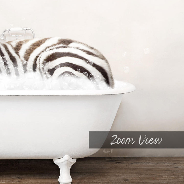 A zebra lying in a white bathtub filled with bubbles, creating a whimsical and playful scene.