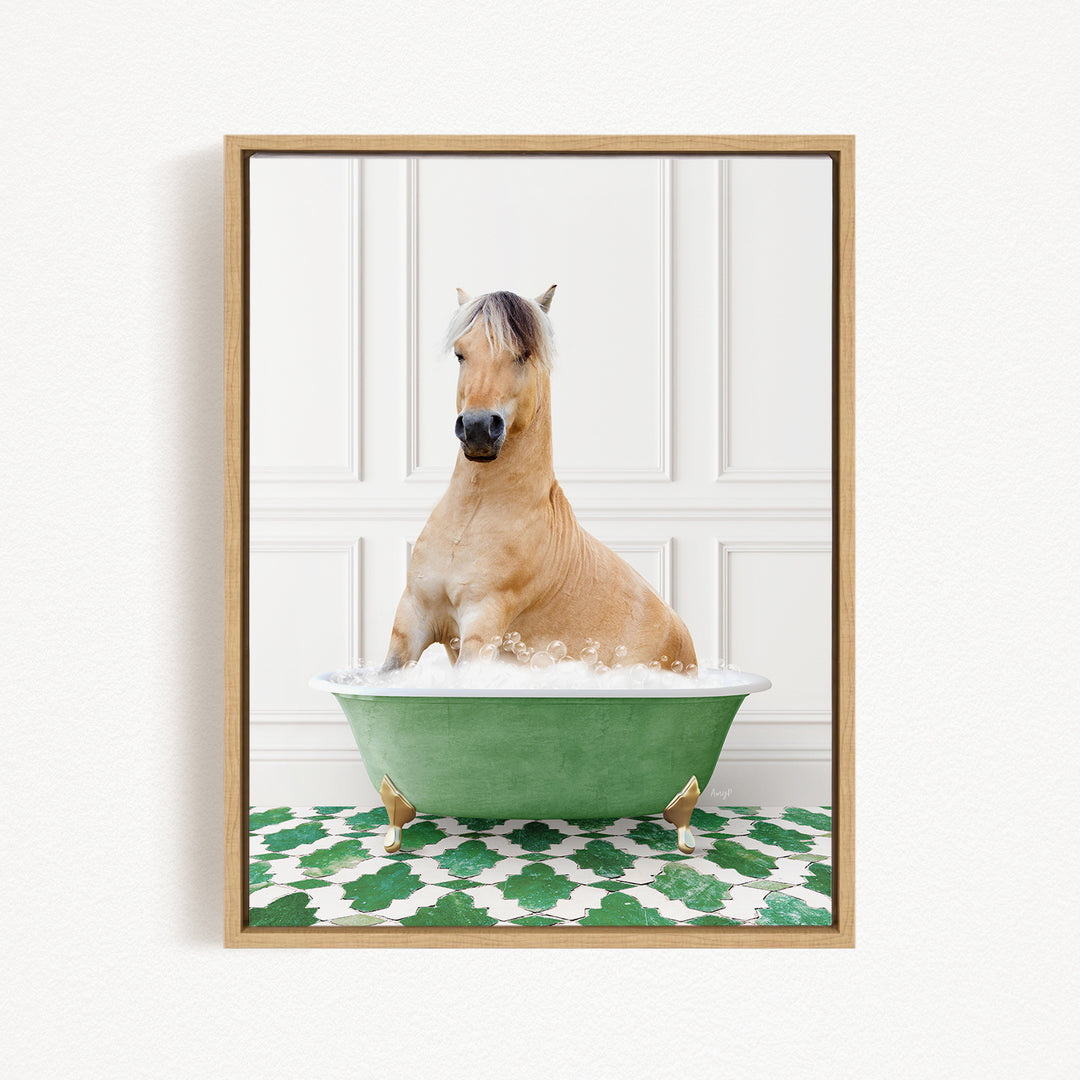 A light brown horse is sitting in a green bathtub filled with water, surrounded by a green and white patterned floor.