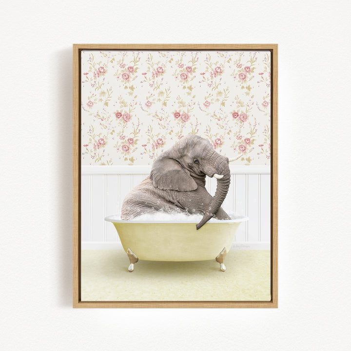 A gray elephant is sitting in a yellow bathtub, surrounded by a floral wallpaper.