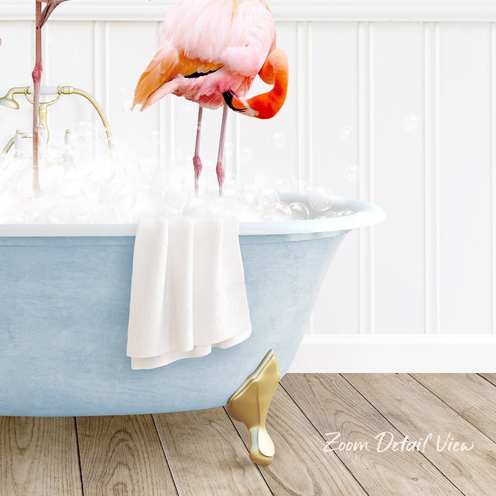 A pink flamingo standing in a blue bathtub filled with water, with a towel hanging on the side and a gold claw-like object on the floor.
