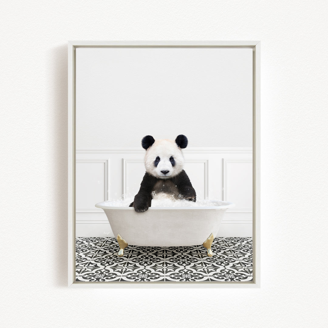 A panda bear sitting in a white bathtub filled with bubbles, surrounded by a black and white patterned floor.