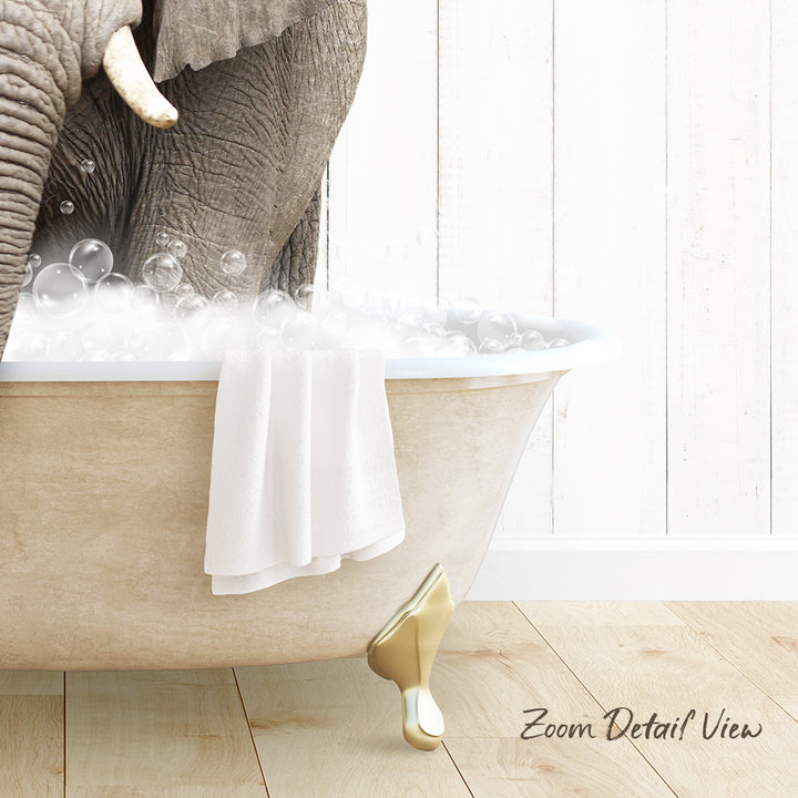 A large elephant is taking a bath in a white clawfoot bathtub, surrounded by bubbles.