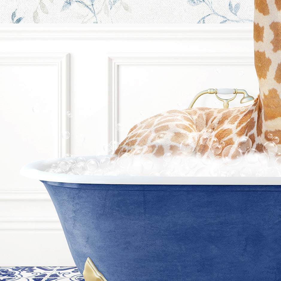 a giraffe laying in a blue bath tub