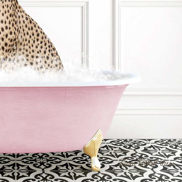 A pink clawfoot bathtub filled with bubbles, with a leopard print pattern on the wall behind it.