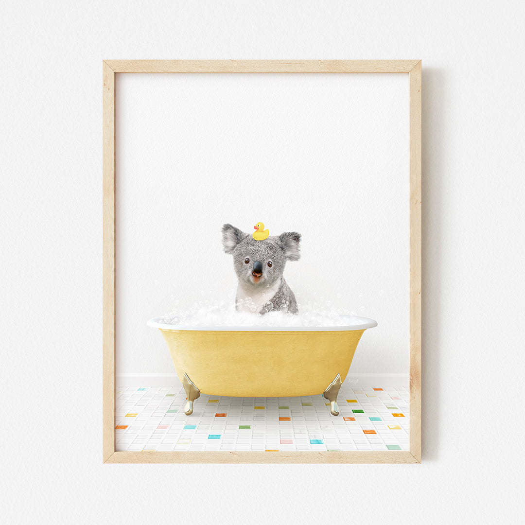 a framed photo of a koala in a bathtub