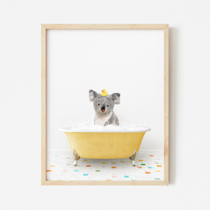 a framed photo of a koala in a bathtub