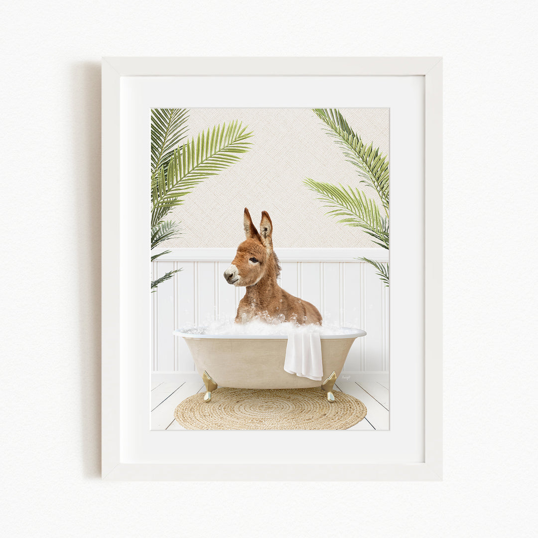 A donkey is sitting in a bathtub filled with water, surrounded by green plants.
