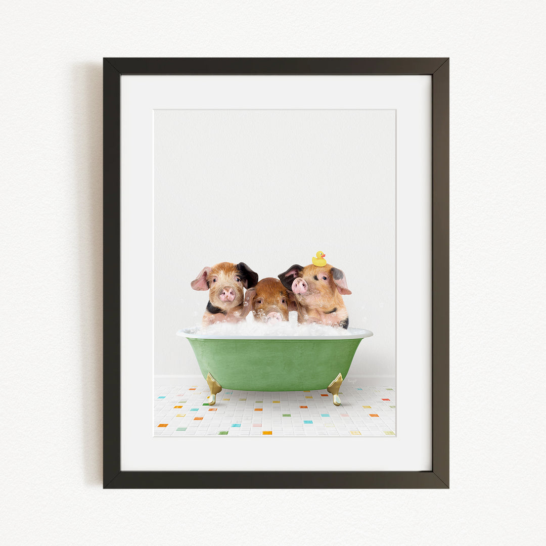 Three adorable pigs sitting in a green bathtub, enjoying a bath together.