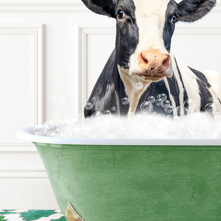 a black and white cow in a green bath tub