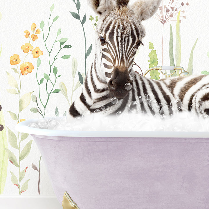 a baby zebra laying in a bathtub next to an adult zebra