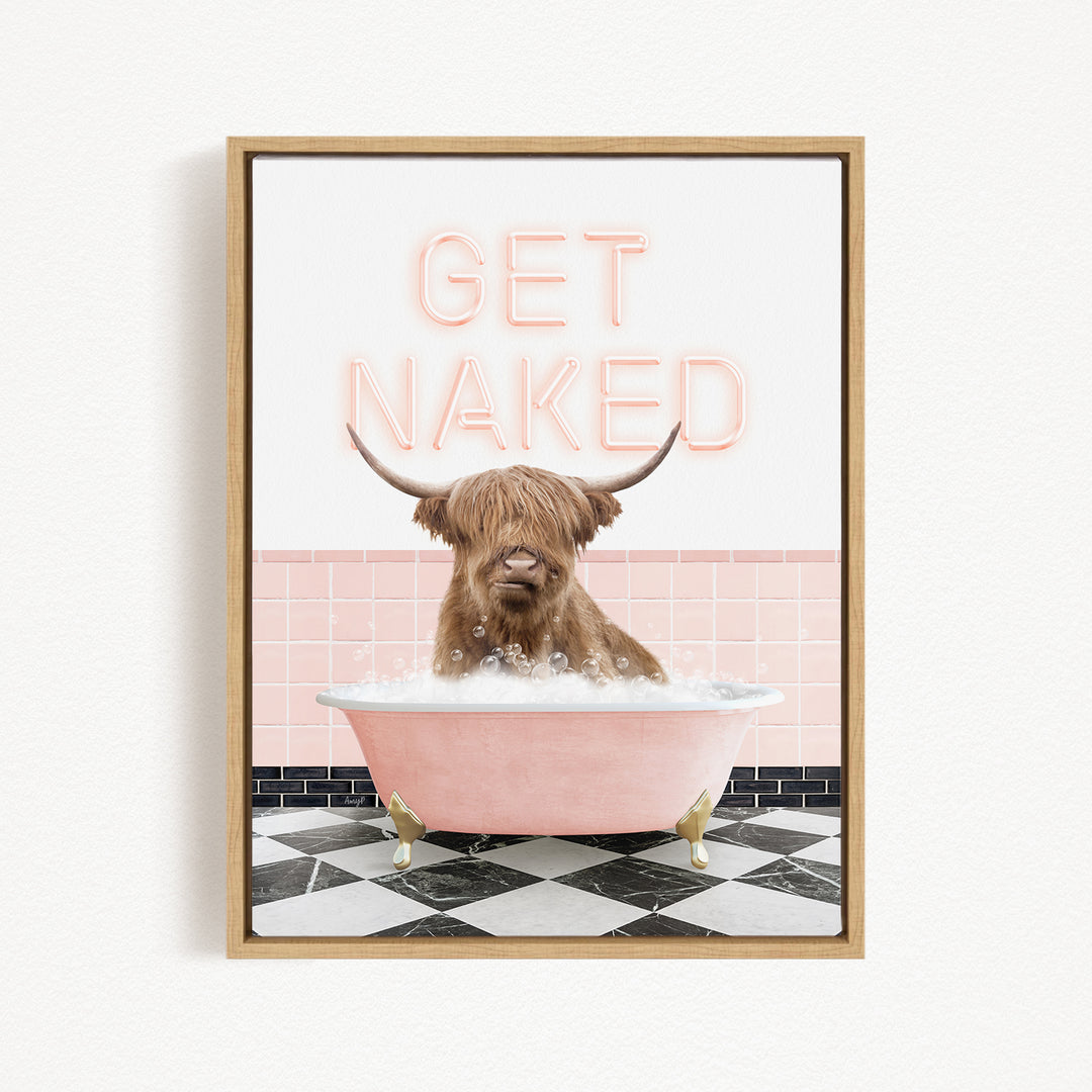 A framed image depicting a horned animal, likely a yak or a similar animal, sitting in a pink bathtub filled with bubbles, with the text "GET NAKED" displayed above it.