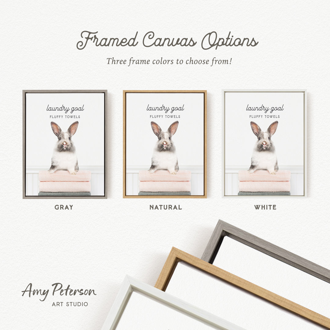 The image is a framed canvas option featuring three different colored frames with a picture of a fluffy towel rabbit.