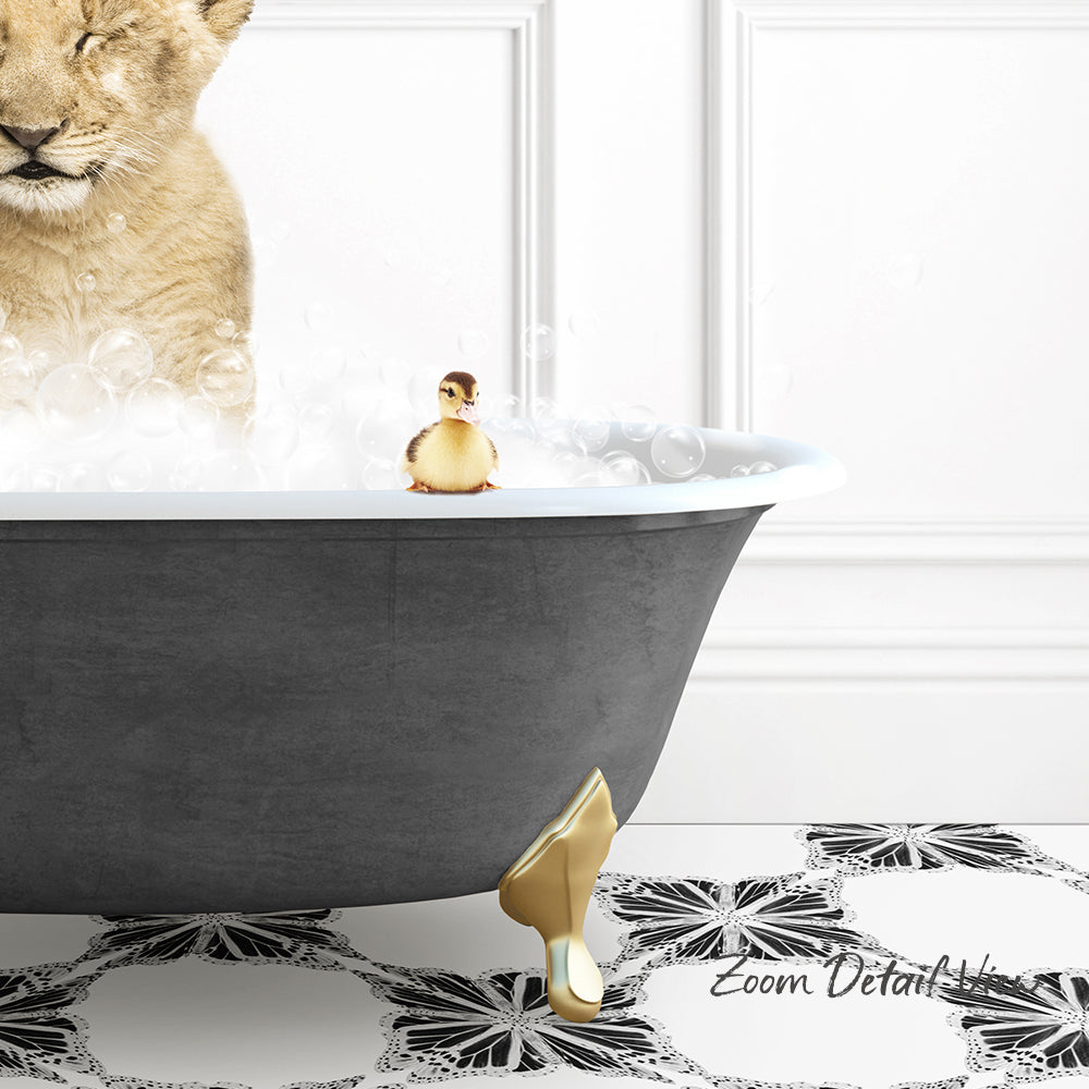 A golden bathtub filled with bubbles, with a small yellow duck sitting on the edge and a lion's head peeking out from behind the tub.