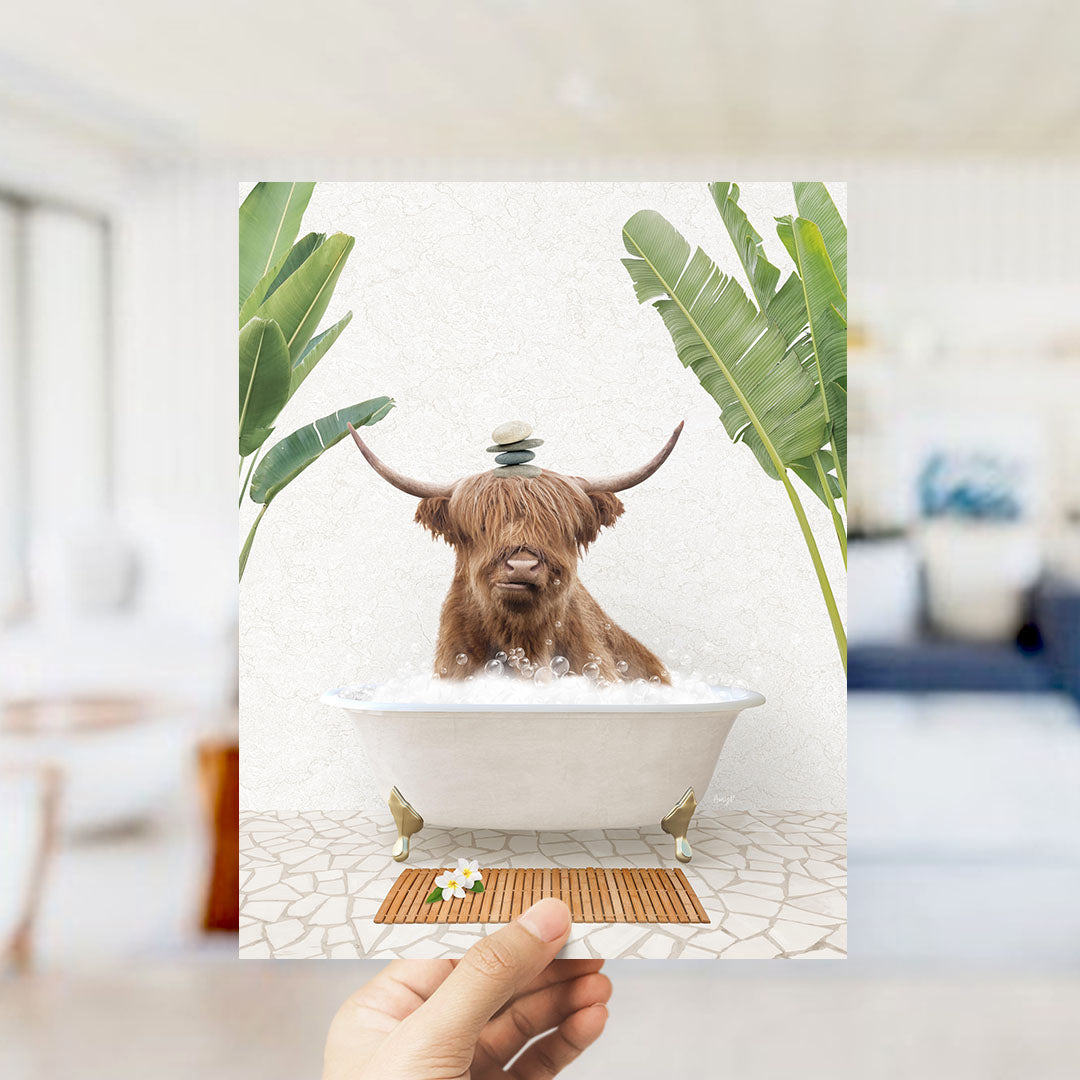 A brown cow with horns is sitting in a bathtub filled with water, surrounded by green plants.