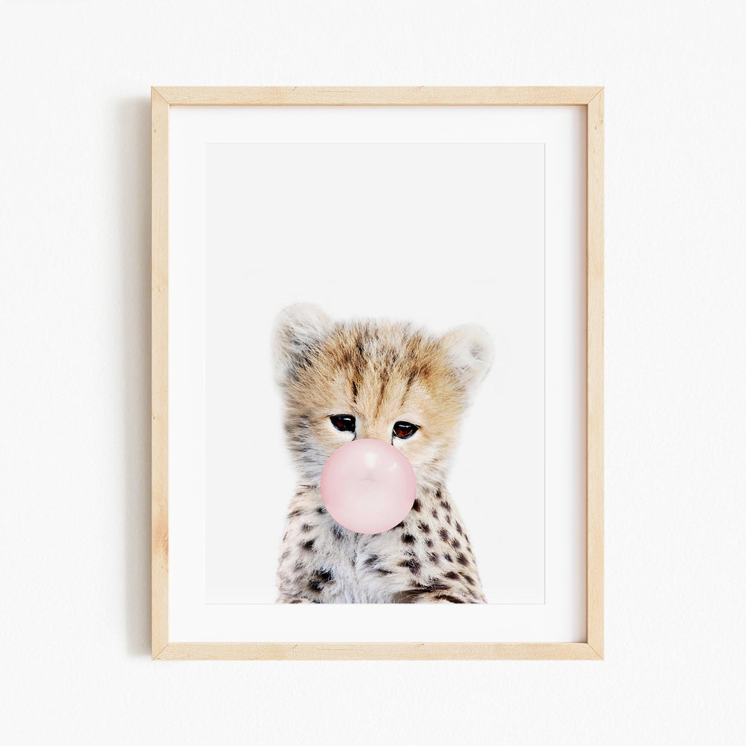 a picture of a baby cheetah with a bubble gum