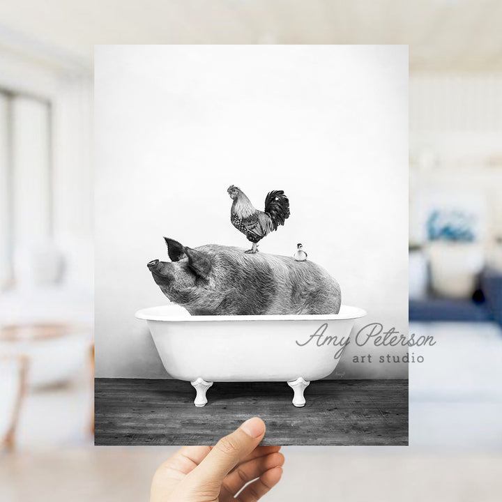 a black and white photo of a pig in a bathtub