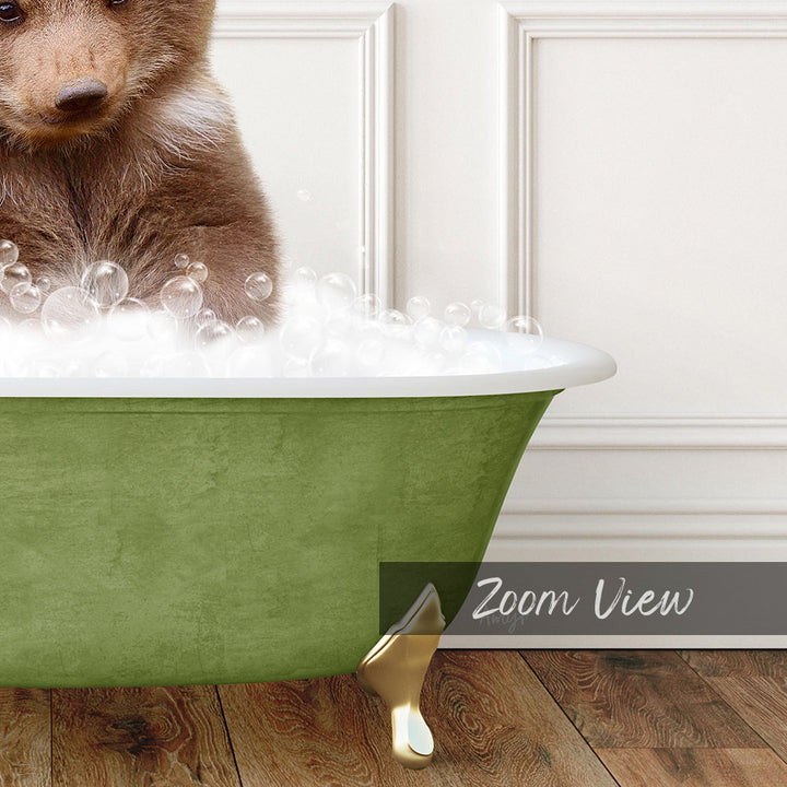 A brown bear sitting in a green bathtub filled with bubbles, with a white wall and wooden floor in the background.