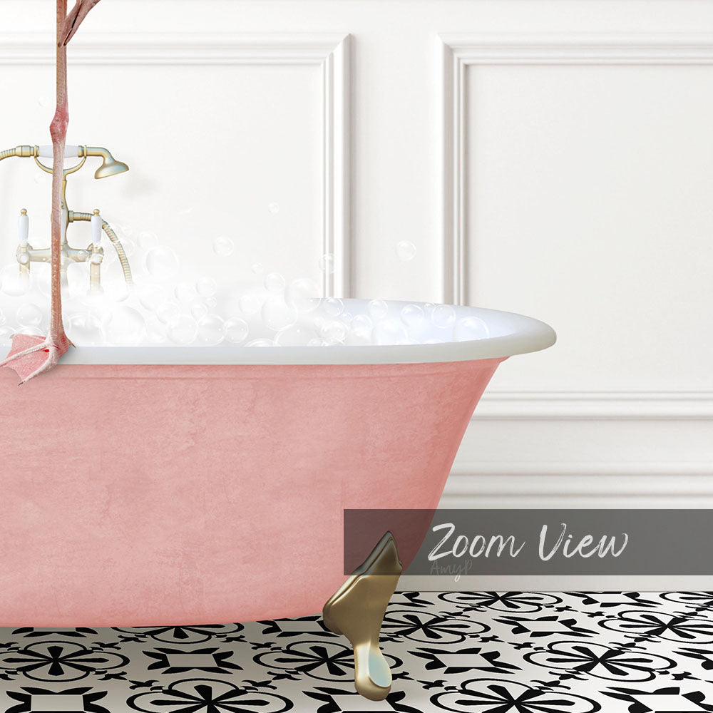 A pink claw-foot bathtub filled with bubbles, set against a white wall with a black and white patterned floor.