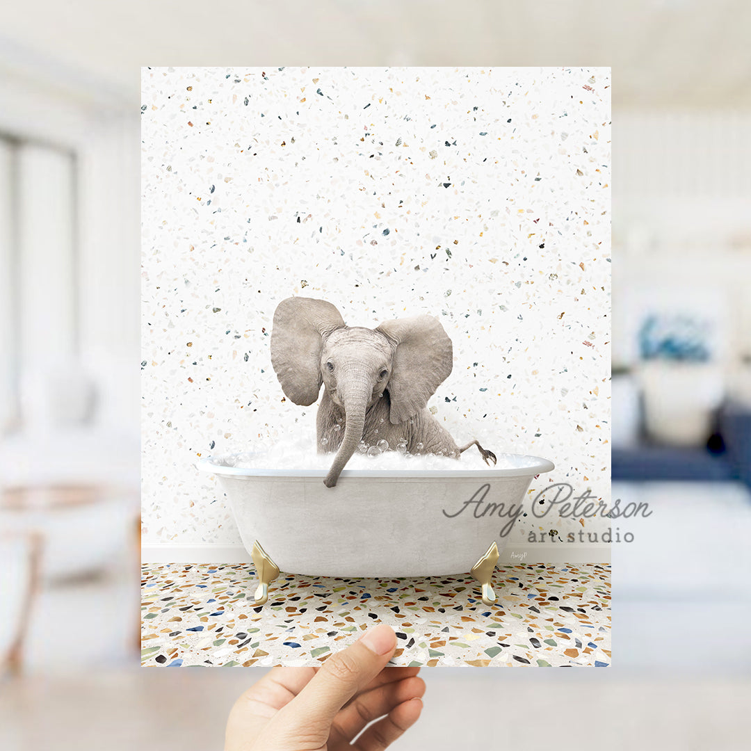 a hand holding up a card with an elephant in a bathtub