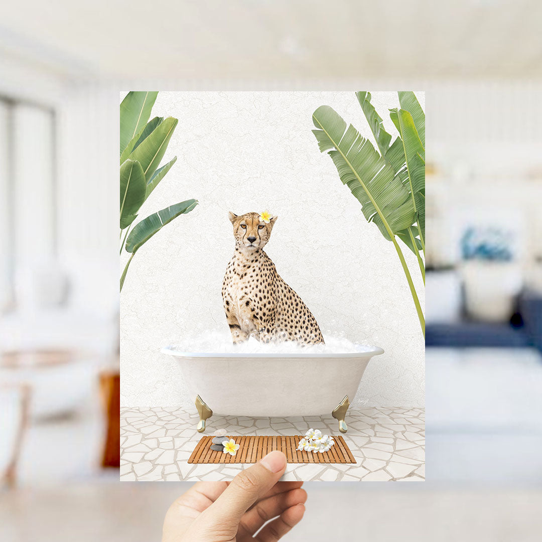 A cheetah sitting in a bathtub filled with water, surrounded by tropical plants.