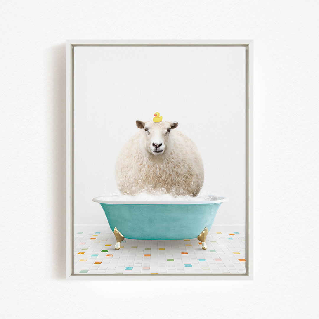 A fluffy white sheep sits in a blue bathtub filled with bubbles, with a yellow rubber duck perched on its head.