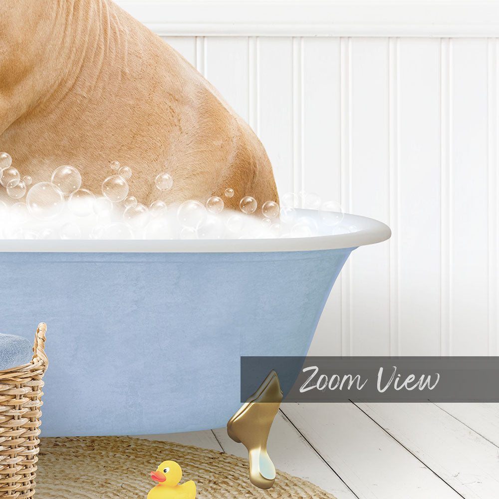 A dog is taking a bath in a blue tub filled with bubbles, with a yellow rubber duck nearby.